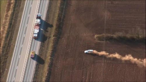 Car chase in a field